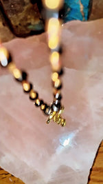Load and play video in Gallery viewer, The &quot;NO BAD VIBES&quot; 24k Black ObsidianX Garnet Charm Necklace
