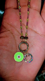 Load and play video in Gallery viewer, Amethyst x Peridot 24k Evil Eye Charm Necklace
