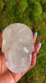 Load and play video in Gallery viewer, 10&quot; Inch Circumference Clear Quartz Crystal Skull With Lepidocrosite Inclusions